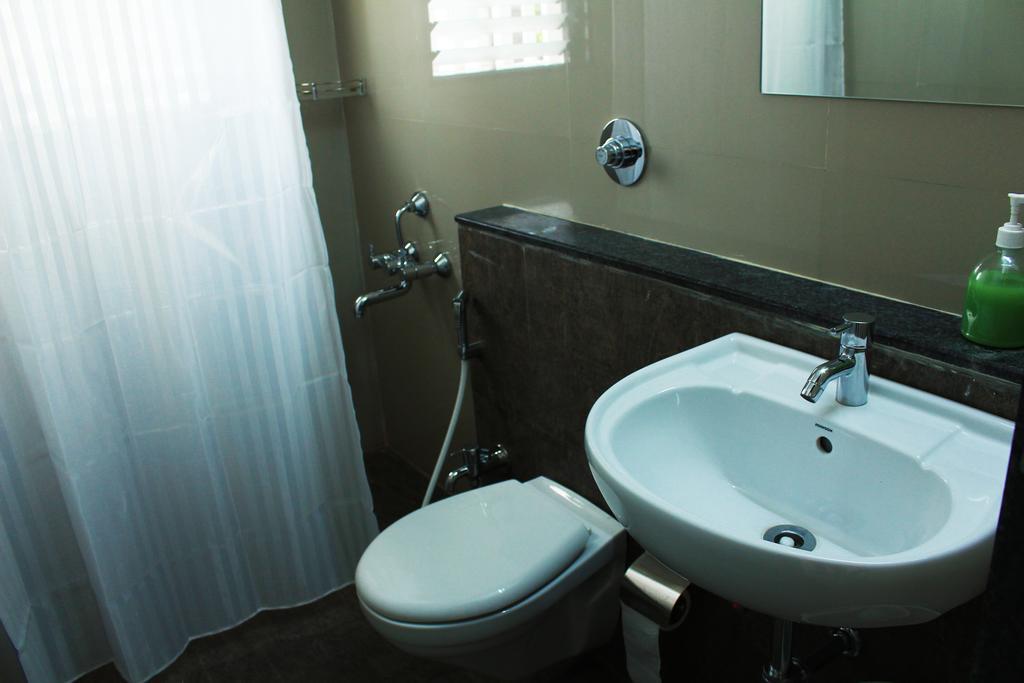 Aashiyana Inn Nashik Oda fotoğraf